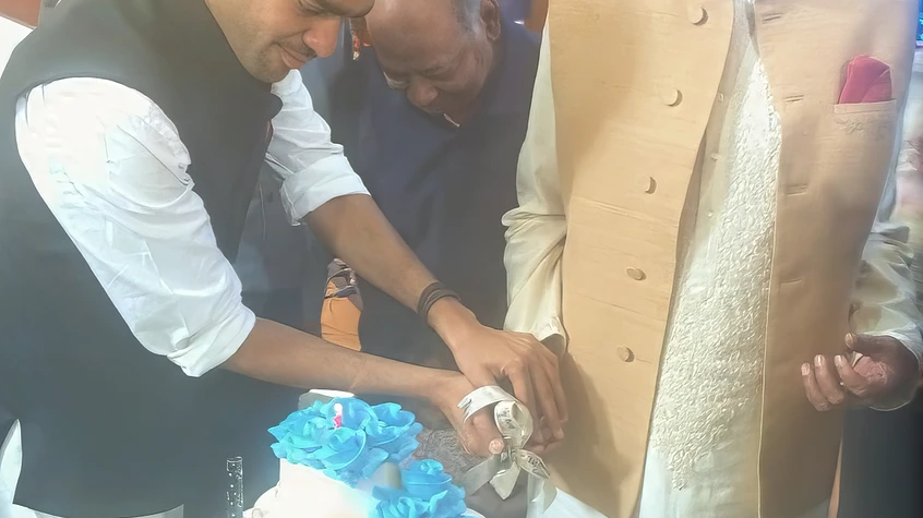 Dadu and Prateek Cutting Cake