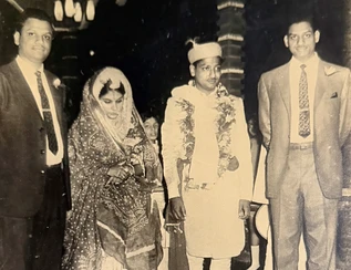 Vintage photo: Ajay Rungta (Dadu) at Ashok Rungta's wedding, with the groom, bride, and another guest. Black and white.