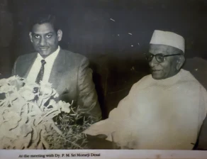 Vintage black and white photo: Ajay Rungta (Dadu) seated with Deputy Prime Minister Morarji Desai during a meeting.