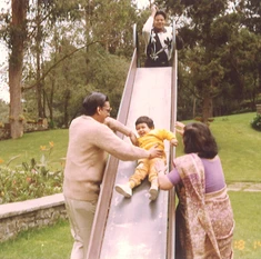 Doting grandfather Ajay Rungta (Dadu) helps his grandchild Popo slide down, with Ma and another woman present in a park.