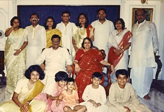 Indoor group photo of the Rungta family for Diwali. Ajay Rungta (Dadu) is seated centrally, surrounded by family members in festive attire.