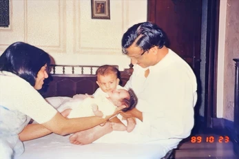 Ajay Rungta (Dadu) with Ma, grandson Bhaiya, and infant granddaughter Tanya Didi (3 weeks old). Indoor family photo from 1989.